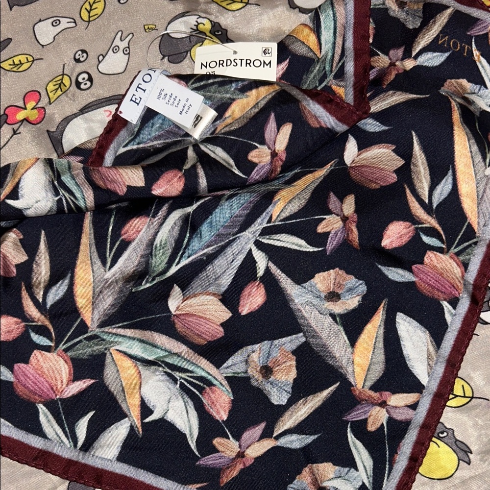 This is an Eton floral print silk pocket square